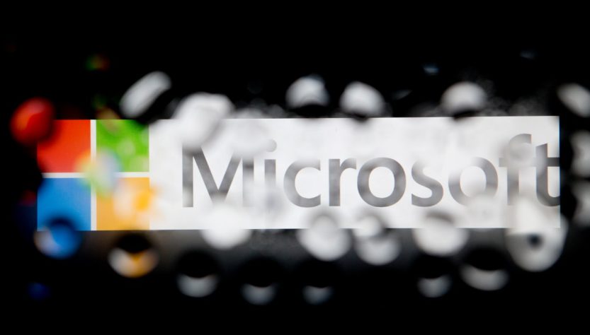 Microsoft faces criticism for warning a security researcher of a potential criminal investigation.